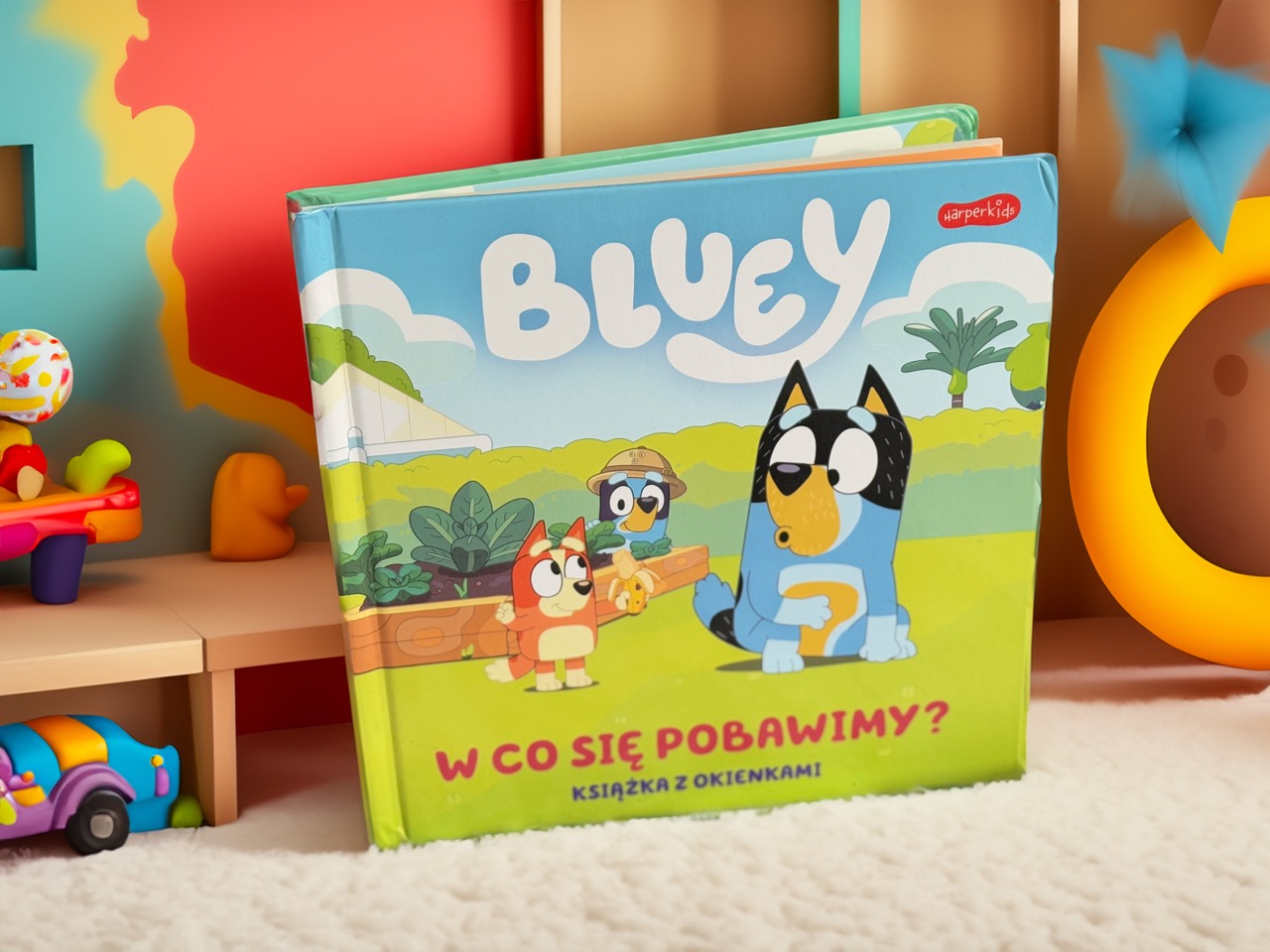 Bluey. W co się pobawimy? Książka z okienkami